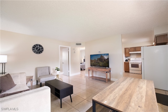 tiled living room with a textured ceiling