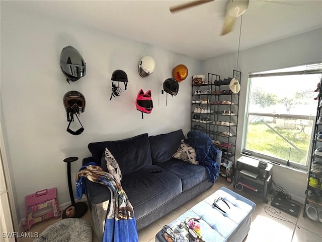 tiled living room featuring ceiling fan