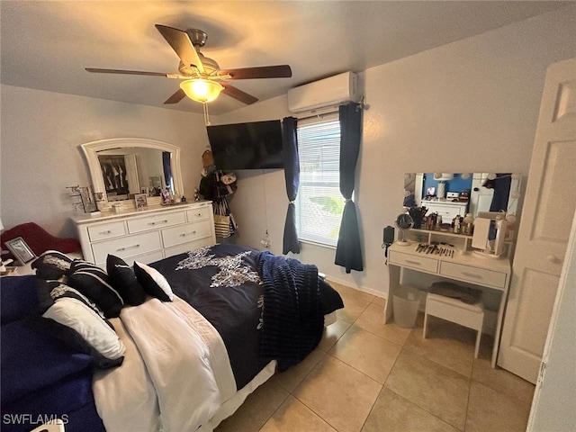 tiled bedroom with a wall mounted AC and ceiling fan