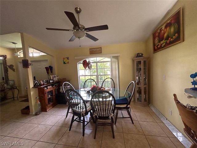 tiled dining room with ceiling fan