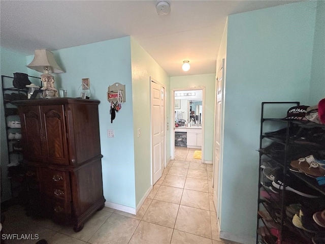 hallway with light tile patterned floors