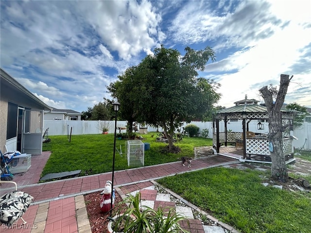 view of yard with a gazebo and a patio