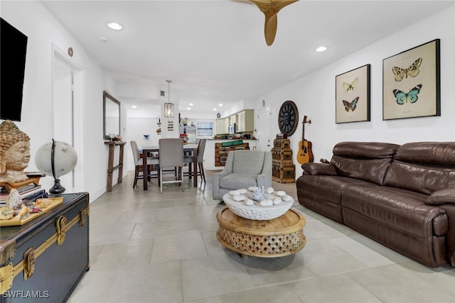 living room with light tile patterned flooring and recessed lighting