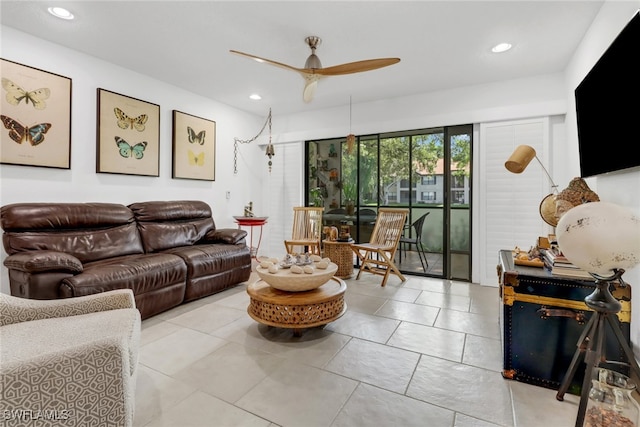 tiled living area featuring a ceiling fan and recessed lighting