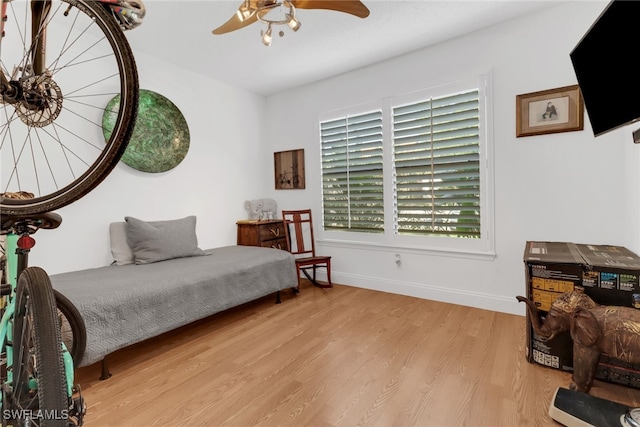 bedroom featuring light hardwood / wood-style flooring and ceiling fan