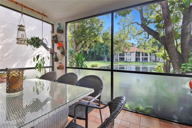 sunroom with a water view