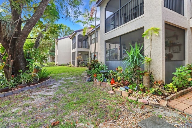 view of yard featuring a balcony