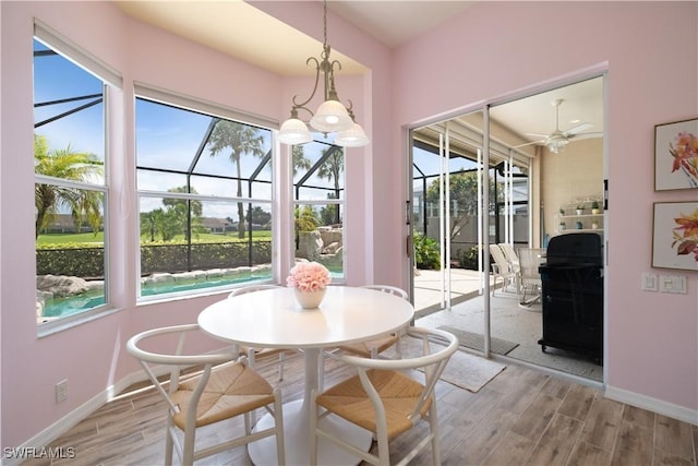 dining room with light hardwood / wood-style flooring and ceiling fan