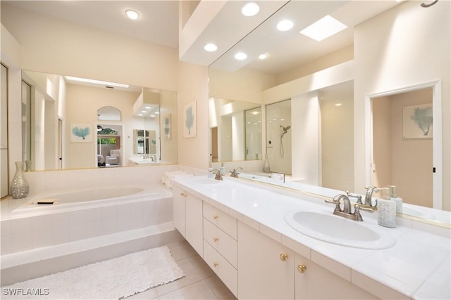 bathroom with tile patterned flooring, vanity, and independent shower and bath