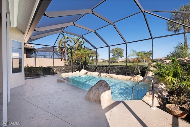 view of swimming pool with a patio and glass enclosure