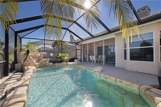 view of pool featuring a lanai and a patio