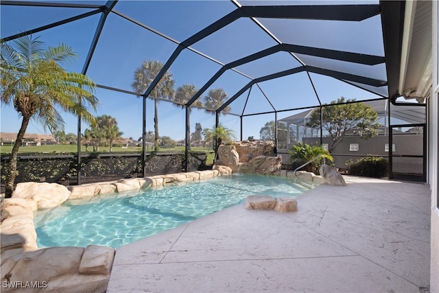 view of swimming pool with glass enclosure