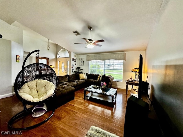 living room featuring a textured ceiling, ceiling fan, and hardwood / wood-style flooring