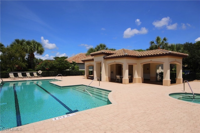 view of swimming pool featuring a patio area