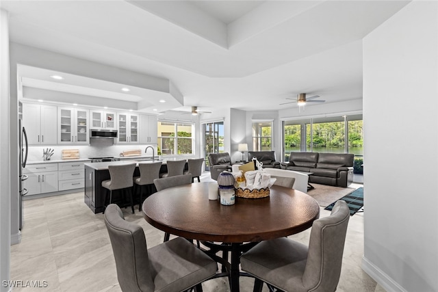 dining room featuring ceiling fan