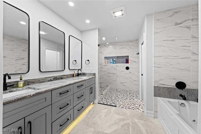 bathroom with separate shower and tub and vanity