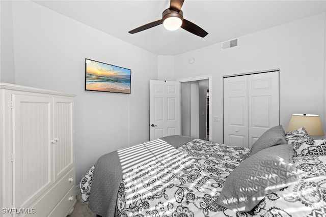 bedroom with ceiling fan and a closet