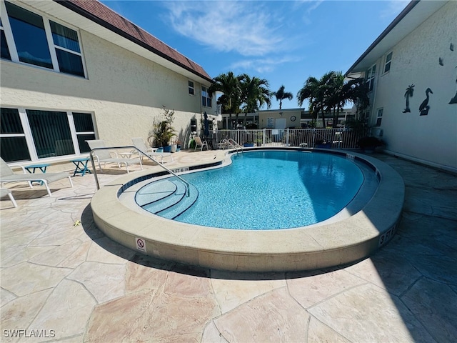 view of pool featuring a patio area