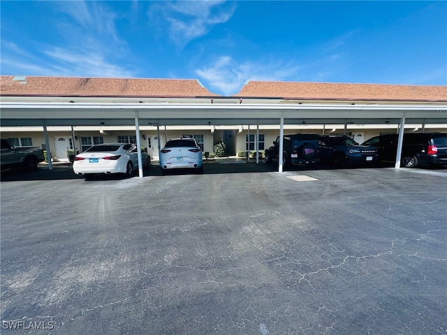 view of vehicle parking featuring a carport