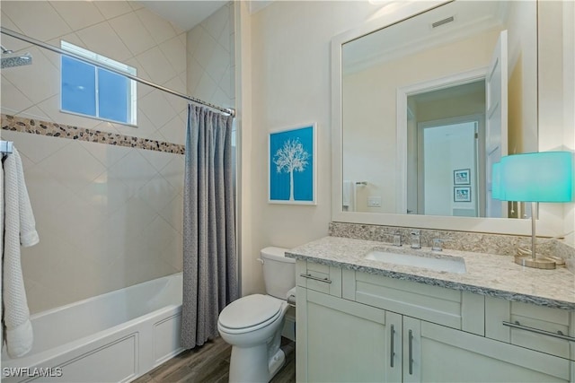 full bathroom with shower / bath combination with curtain, toilet, wood-type flooring, and vanity