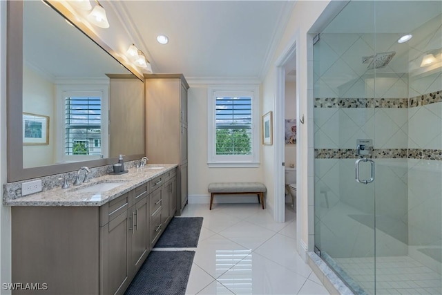 bathroom featuring vanity, tile patterned floors, toilet, ornamental molding, and a shower with shower door