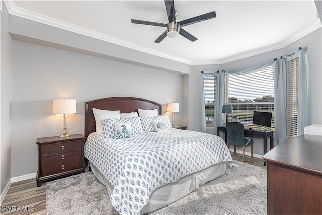 bedroom featuring crown molding, ceiling fan, and hardwood / wood-style flooring