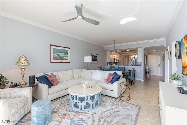 living room with ceiling fan with notable chandelier, crown molding, and light tile patterned floors