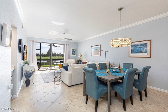 tiled dining area featuring ceiling fan and ornamental molding