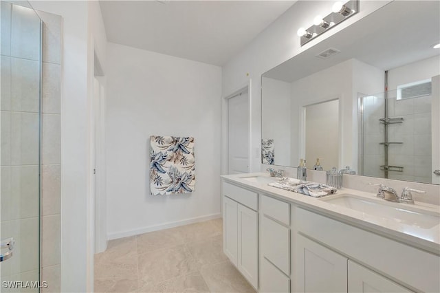 bathroom with tile patterned flooring and vanity