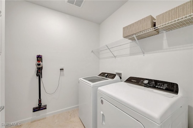 washroom featuring independent washer and dryer