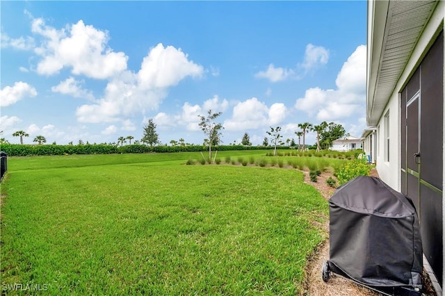 view of yard with a rural view