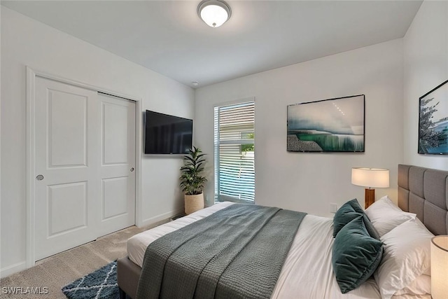 carpeted bedroom featuring a closet