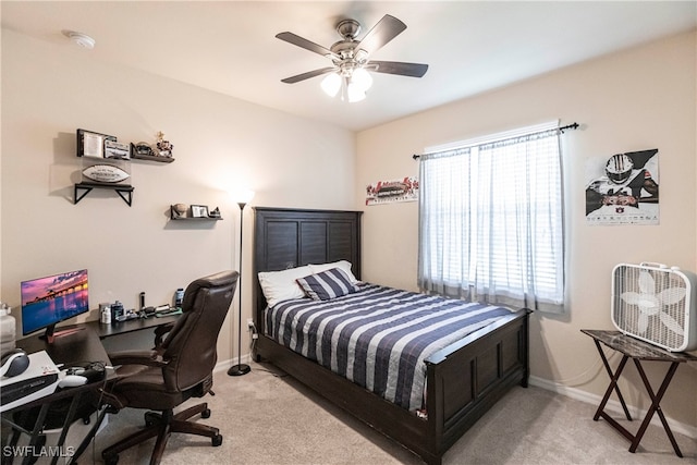 bedroom featuring ceiling fan and light colored carpet