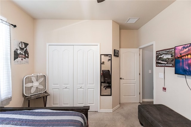 carpeted bedroom featuring a closet and ceiling fan