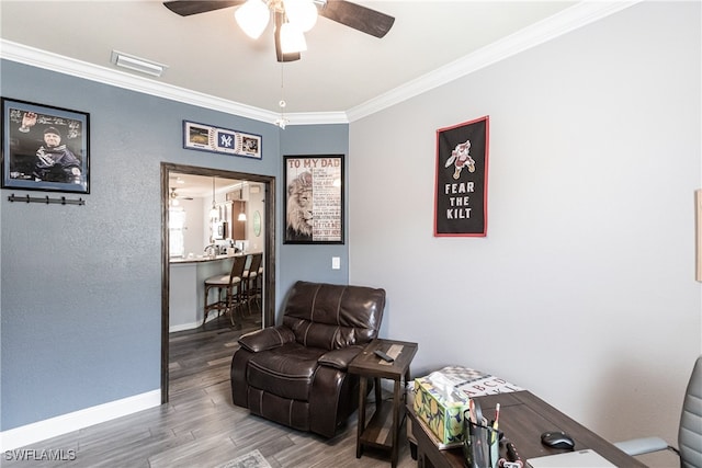 living area with crown molding, ceiling fan, and hardwood / wood-style floors