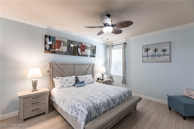 bedroom featuring light hardwood / wood-style flooring, ceiling fan, and ornamental molding