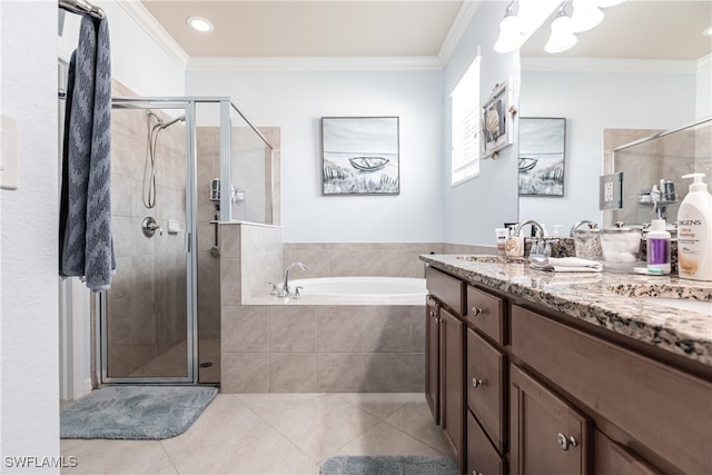 bathroom with ornamental molding, vanity, separate shower and tub, and tile patterned flooring