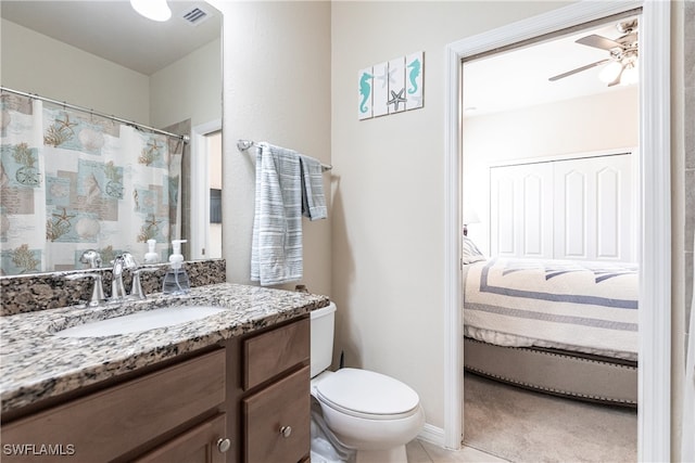 bathroom with vanity, ceiling fan, tile patterned floors, and toilet