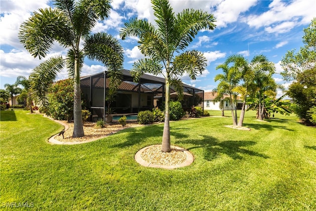 view of yard featuring a lanai