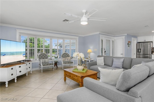 tiled living room featuring crown molding and ceiling fan