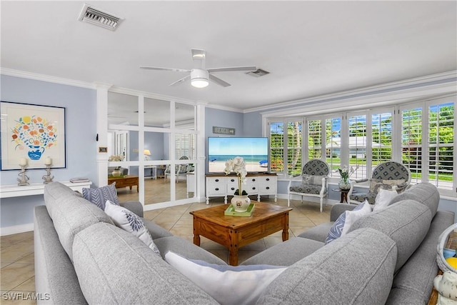 tiled living room with crown molding, ceiling fan, and a healthy amount of sunlight