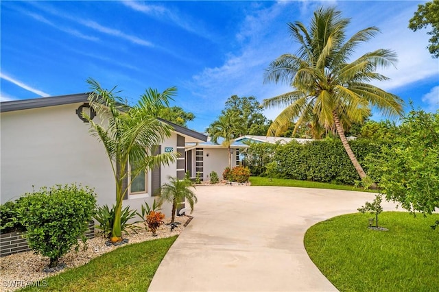 exterior space featuring a front lawn