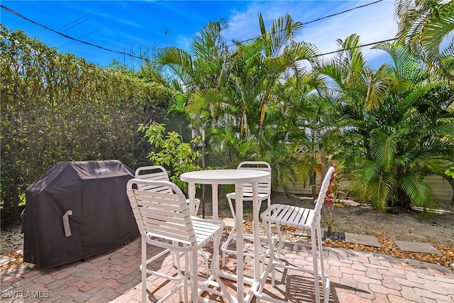 view of patio featuring a grill