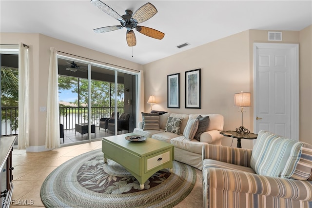 living room featuring light tile patterned flooring and ceiling fan