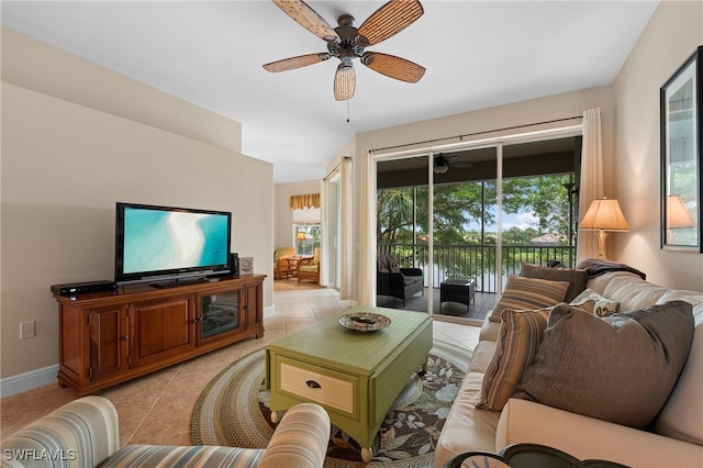 tiled living room featuring ceiling fan