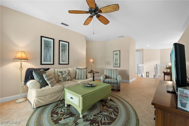 living room featuring light tile patterned floors and ceiling fan