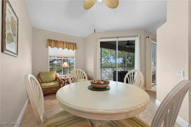 dining space with light tile patterned floors and ceiling fan