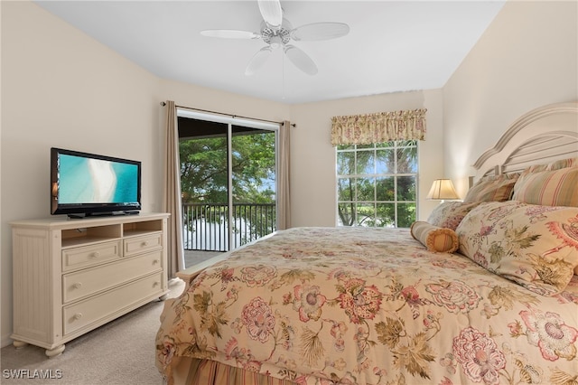 carpeted bedroom featuring access to exterior and ceiling fan