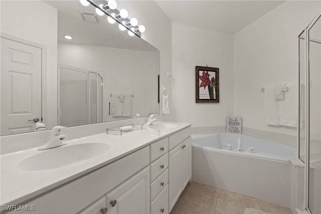 bathroom featuring vanity, tile patterned floors, and plus walk in shower