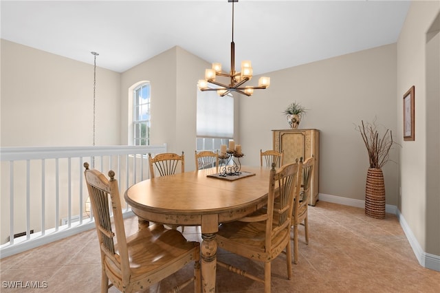 tiled dining room featuring a notable chandelier